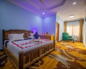 Pretty Pride Hotel - Kumasi - Schlafzimmer