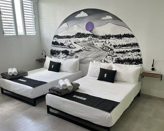 Nomada Beach Hostel- Isla Verde - סן חואן - חדר שינה