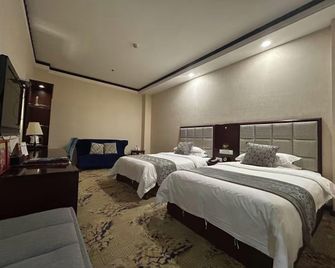 Wuzhou Hotel (Taihang Road Branch) - Anyang - Bedroom