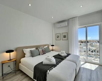 Faro Deluxe by Homing - Faro - Bedroom