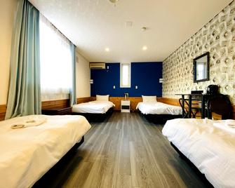 Petit Hotel Melon Furano - פוראנו - חדר שינה