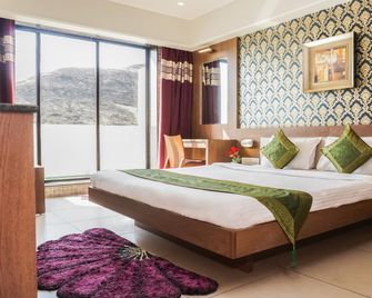 Treebo Trend Shri Vitthal Mangalam - Sātāra - Bedroom