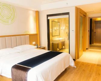 Greentree Inn Jiangsu Taizhou Taixing Middle Guoqing Road Business Hotel - Taizhou - Slaapkamer