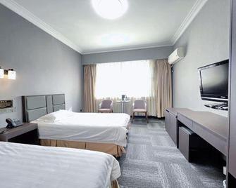Meidu Hotel - Fushun - Schlafzimmer