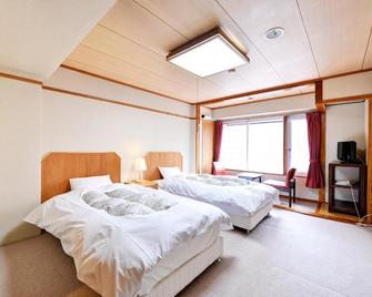 Ishinoyu Lodge - Yamanouchi - Bedroom
