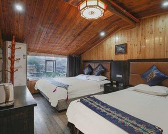 Qianzhuang Holiday Hotel - Qiandongnan - Bedroom