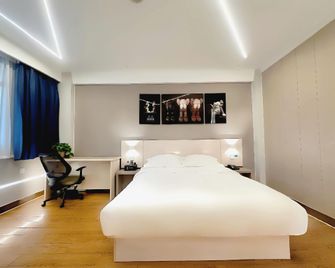 7 Days Premium Hotel Kaifeng Songcheng Road Jingxi - Kaifeng - Habitación