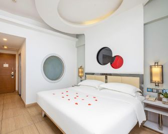 Jiajie Boutique Hotel (Haikou Qilou Old Street Sun Moon Plaza Duty Free Shop) - Haikou - Habitación