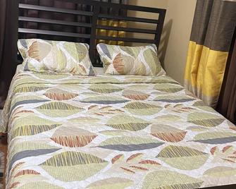 Central Life Dwellings a comfortable home away from home two bedroom house - Chaguanas - Bedroom