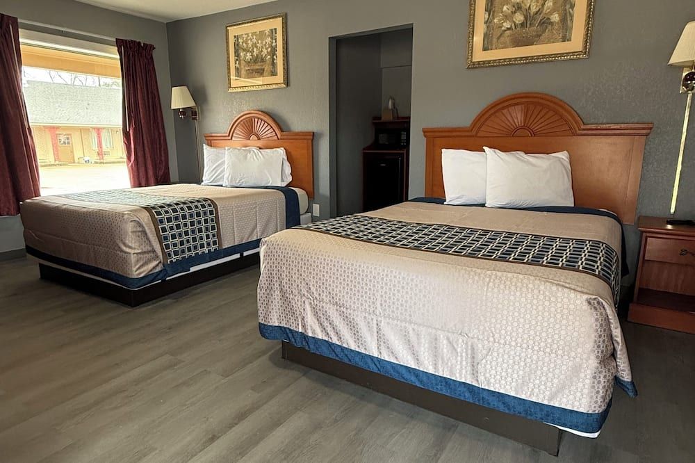 Budget Inn - Magnolia - Schlafzimmer