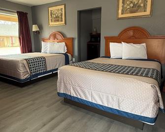Budget Inn - Magnolia - Habitación