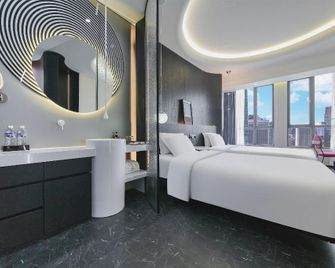 Haodi Hotel (Chongqing Huangnibang Light Rail Station) - Chongqing - Bedroom