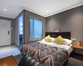 Suqi Hotel (Xinxiang Pangdonglai Da Pang Branch) - Xinxiang - Schlafzimmer