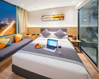 Zhenai Apple Hotel (Linyi commodity wholesale City store) - Linyi - Schlafzimmer