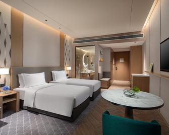 Holiday Inn Wuxi Central Station - Wuxi - Soveværelse