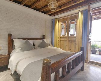 Lijiang Juren Inn - Lijiang - Bedroom