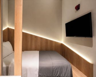 Fast Sleep Suites by Slaviero Hotéis dentro do Aeroporto Guarulhos Terminal 2, desembarque Oeste - Guarulhos