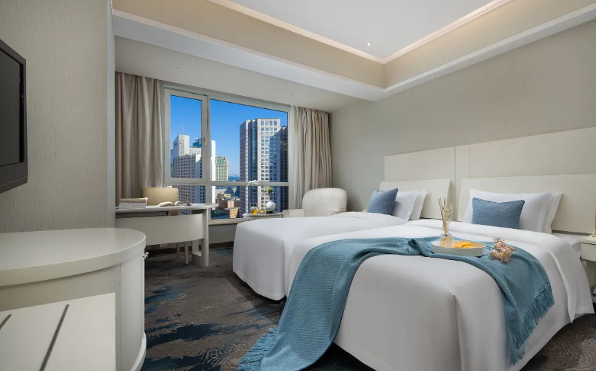 Xinwenyuan Hotel - דאליין - חדר שינה