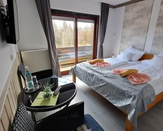 Comfort group house Quellenhof 27 pers. incl. bed linen-towels-near the forest - Altenau (Niedersachsen) - Slaapkamer