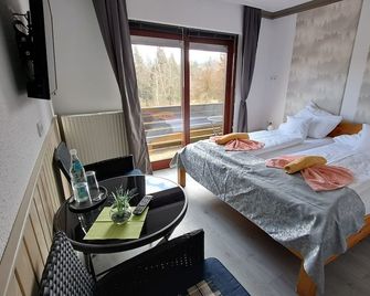 Comfort group house Quellenhof 27 pers. -Near the forest - Altenau (Niedersachsen) - Schlafzimmer
