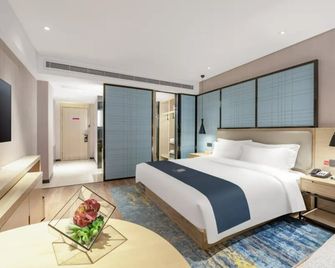 Echarm Hotel Zibo Gaoqing Zhongcheng Inernational - Zibo - Schlafzimmer