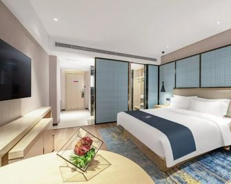 Echarm Hotel Zibo Gaoqing Zhongcheng Inernational - Zibo - Schlafzimmer