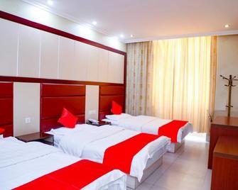 Huaining Hotel - Anqing - Schlafzimmer