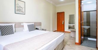 Umuarama Plaza Hotel - Goiânia - Schlafzimmer
