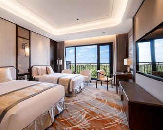Yancheng Gangbo Peninsula Hotel - Yancheng - Bedroom