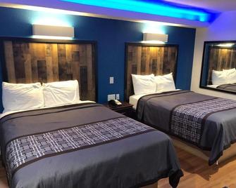 Express Inn Tomball - Tomball - Schlafzimmer