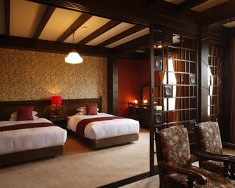 Unzen Kanko Hotel - Unzen - Bedroom