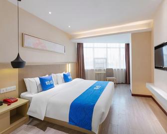 Jianianhua Fashion Hotel - Huanggang - Habitación