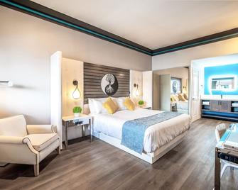 Aspire Inn Studios & Spas - Bellflower - Schlafzimmer