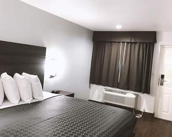 Blue Way Inn By Jasper Near Frost Bank Center -1 King Bed Non Smoking - سان انطونيو - غرفة نوم