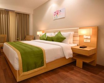 Pushkara Sarovar Portico Dibrugarh - Dibrugarh - Bedroom