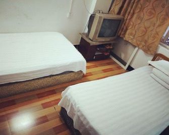 Renxin Inn - Wuhan - Schlafzimmer