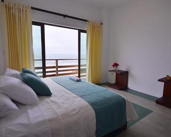 Cormorant Beach House - Puerto Villamil - Camera da letto