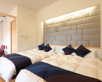 Tojinbo Mikuni Onsen Ootoku - Awara - Camera da letto