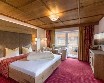 Alpenherz Hotel Garni - גרלוס - חדר שינה