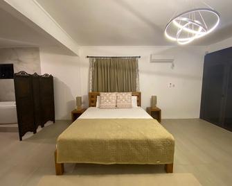 Om Tourist Residence - Trou d'Eau Douce - Chambre