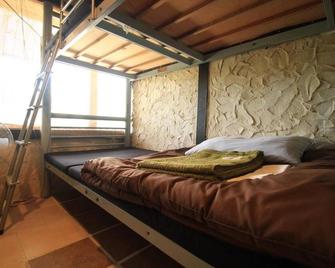 تاكتوميجيما جيست هاوس آند جيتيم - هوستل - إشيغاكي - غرفة نوم