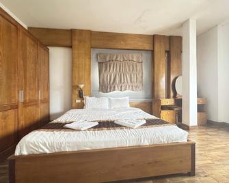 Vang Vieng Golden Lotus Hotel - Vang Vieng - Kamar Tidur