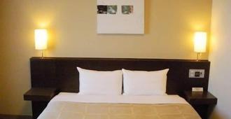 Hotel Route-Inn Miyazaki Tachibana Dori - מיאזאקי - חדר שינה