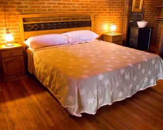 Lauquen Pilmaiquen y spa - Villa de Merlo - Bedroom