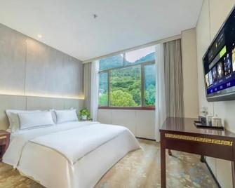Riyue International Hotel - Qiandongnán - Habitación