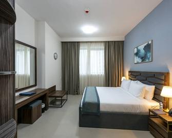 Luxe Grand Hotel Apartments - Charjah - Chambre