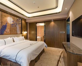 Jiujiang Chengtou Hotel - جيوجيانغ - غرفة نوم