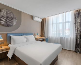 Home Inn Neo Qingdao Shandong Road Central Business District Wanda Plaza - تشينغداو - غرفة نوم