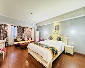 Mingren Holiday Apartment (Nanjing Wanda Plaza) - Nanjing - Schlafzimmer