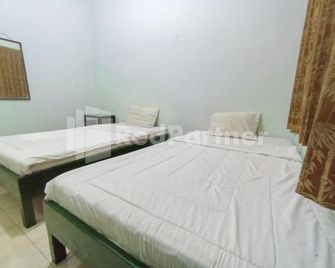 Orange inn RedPartner Madiun - Madiun - Slaapkamer